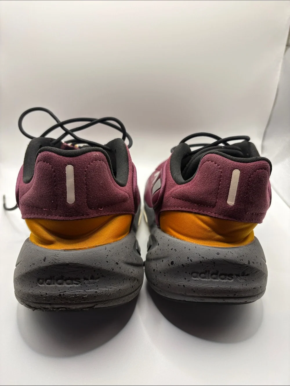 adidas OZELIA Men’s Burgundy and Black Running Sneaker with Yellow Accents